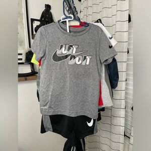 Used- Grey/black and white: Nike short and short sleeve set. Boy size small
